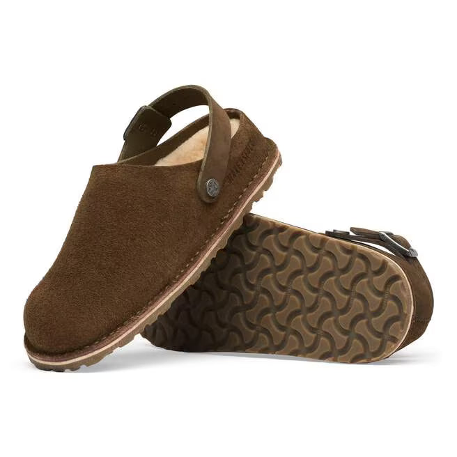 The BIRKENSTOCK Lutry is a slipper that can be worn as a backstrap style or as an open clog thanks to the flexible ankle strap. The footbed can be removed, for you to choose between three different footbed versions. This version features our shearling footbed. The upper is a combination of suede that hugs the foot like a second skin and especially thick, oiled nubuck leather with an open-selvage finish. Removable, anatomically shaped cork-latex footbed 